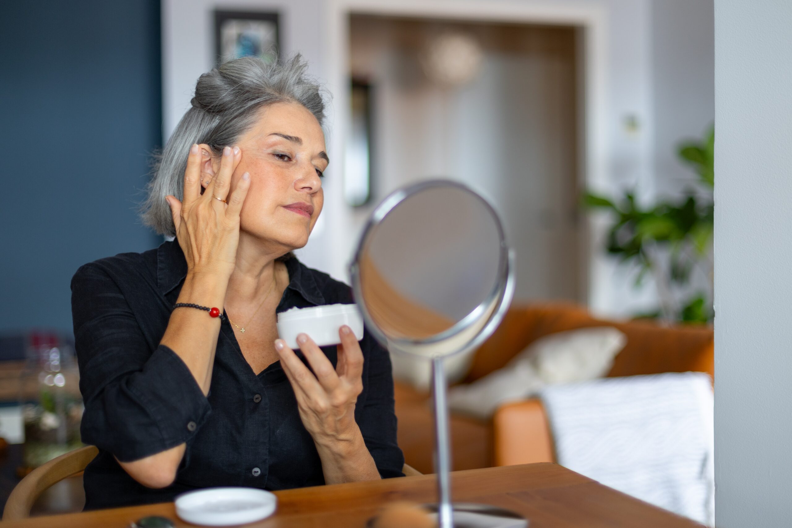 Woman representing different life stages using active skincare by age, an anti ageing serum, and a vitamin C serum in Australia as part of an age-appropriate skincare routine.