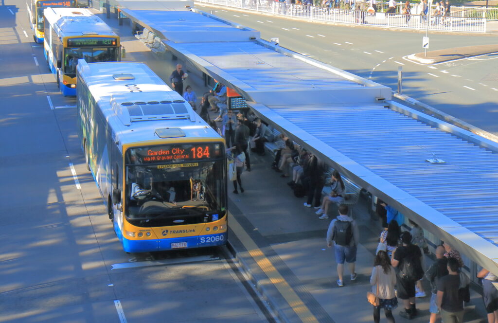 Modern bus shelters with professional public space furniture installation alongside durable school shelters in an Australian streetscape.