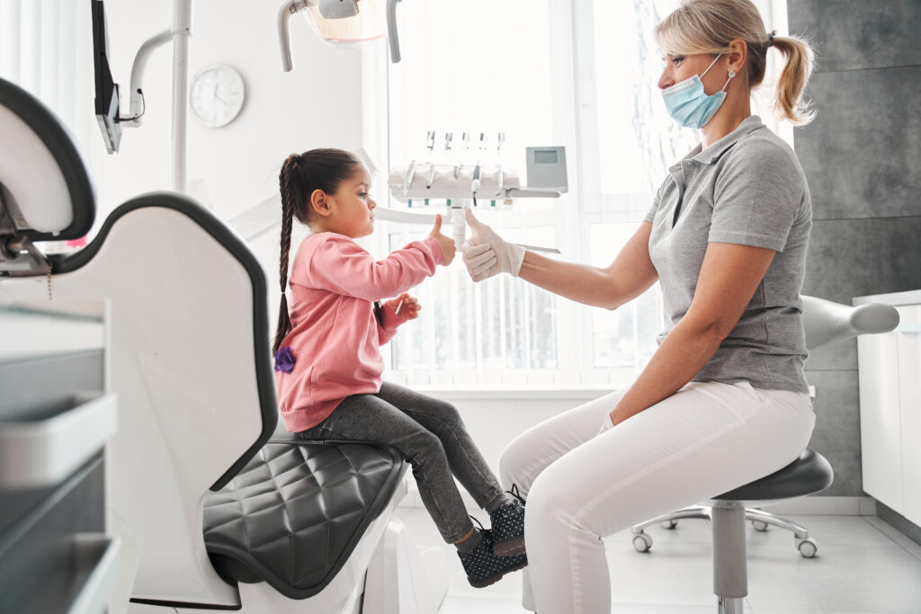 Family discussing affordable braces in Melbourne with an orthodontist, exploring orthodontics for adults and the best orthodontics for kids.