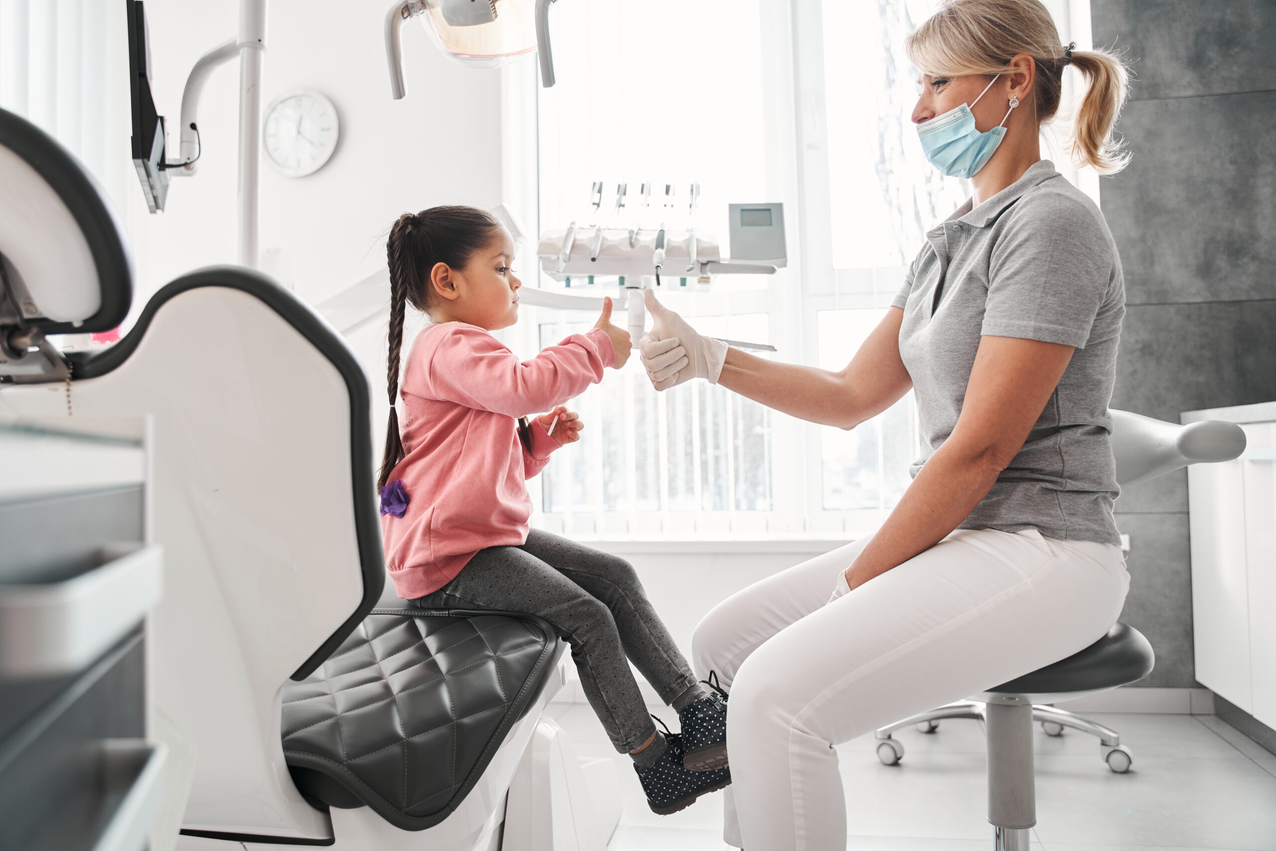 Family discussing affordable braces in Melbourne with an orthodontist, exploring orthodontics for adults and the best orthodontics for kids.