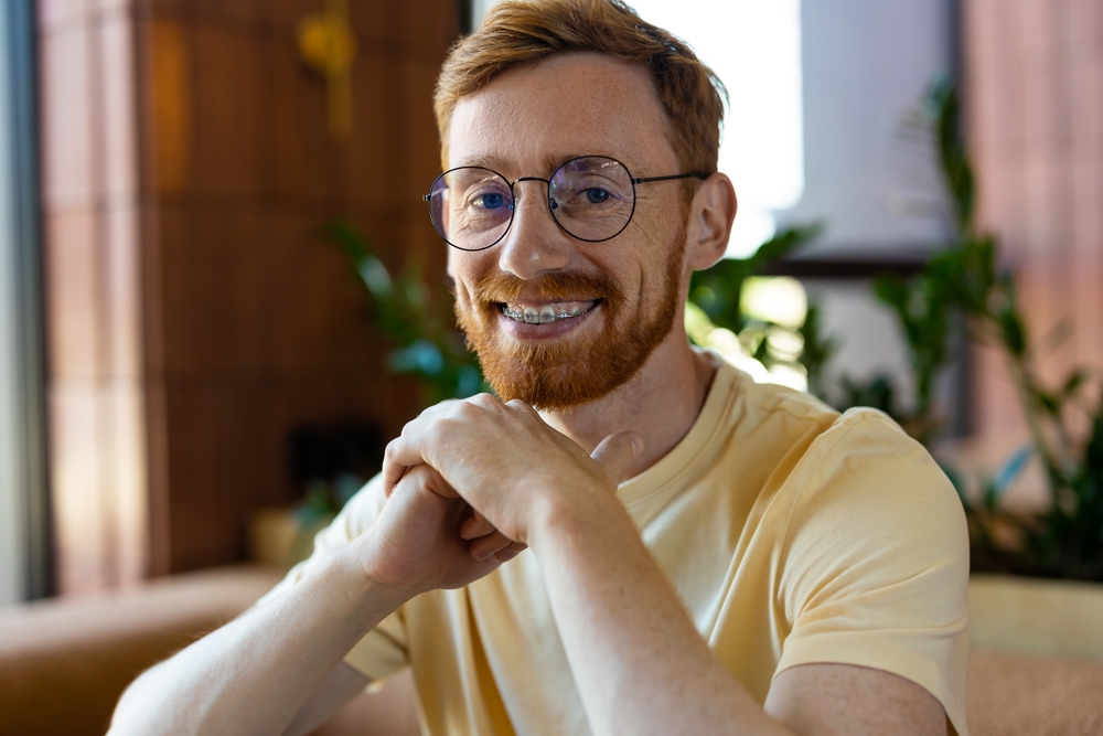 Adult patient comparing orthodontic treatments for adults, adult braces and Invisalign options with an orthodontist.